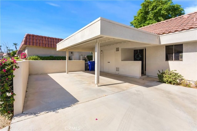 view of patio / terrace featuring a carport