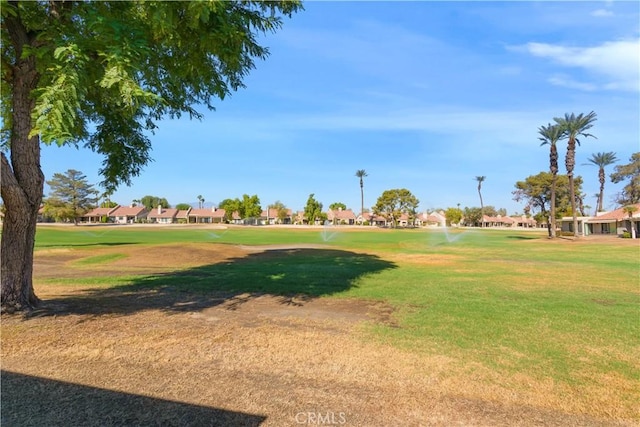 surrounding community featuring a lawn