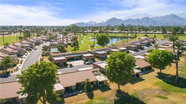 bird's eye view with a water and mountain view