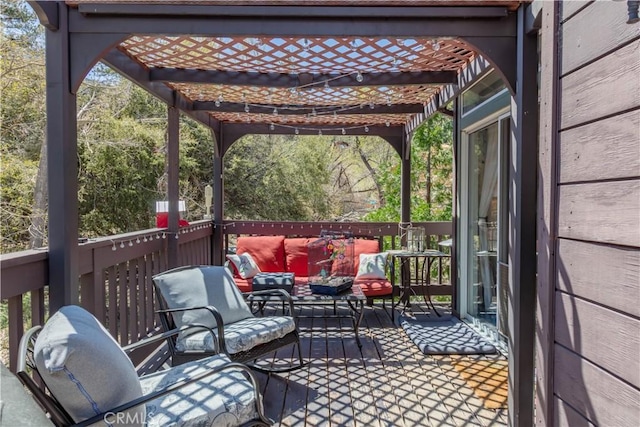 deck featuring a pergola and an outdoor hangout area