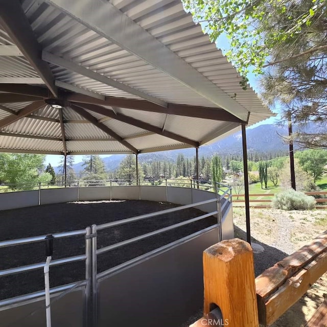 view of horse barn featuring a mountain view