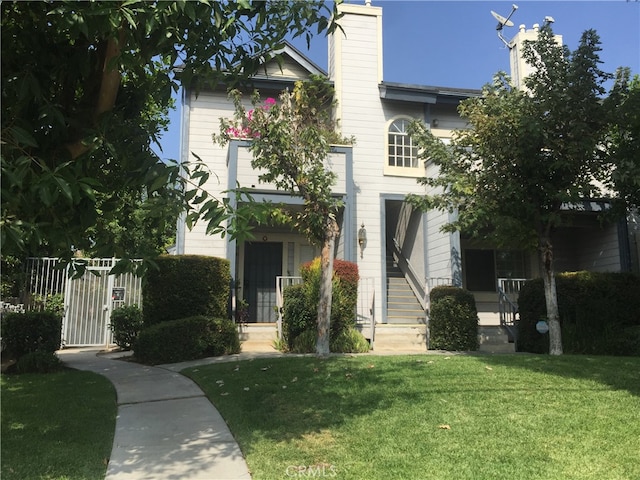 view of front of home with a front lawn