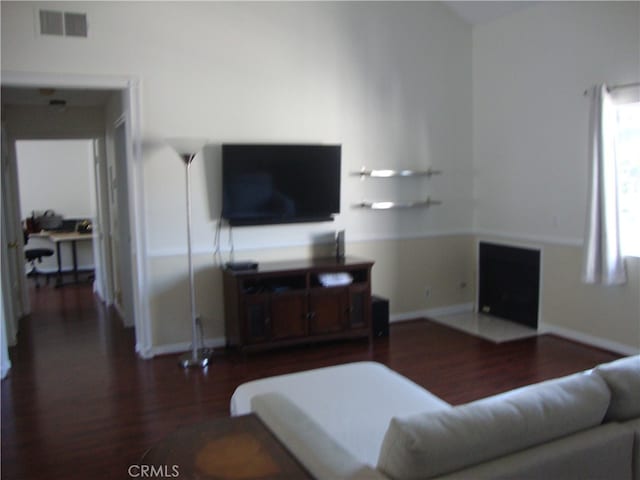 living room featuring dark hardwood / wood-style flooring