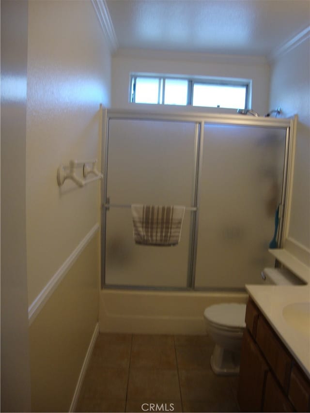 full bathroom featuring shower / bath combination with glass door, toilet, a wealth of natural light, and vanity