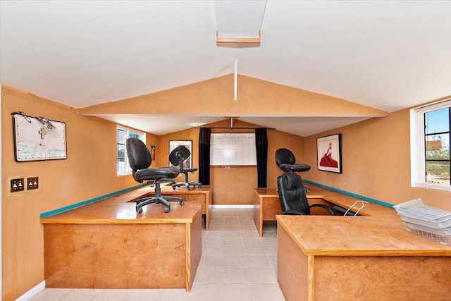 tiled home office featuring vaulted ceiling