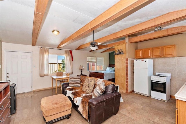 living room featuring beamed ceiling, tile walls, and ceiling fan