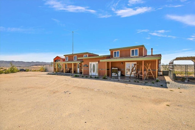 back of property with a mountain view