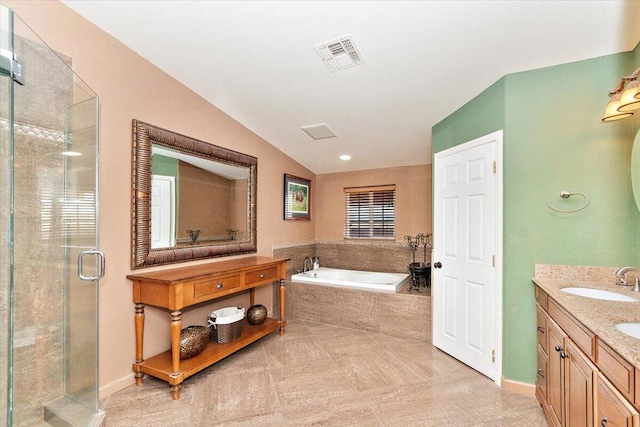 bathroom featuring vanity, vaulted ceiling, and separate shower and tub