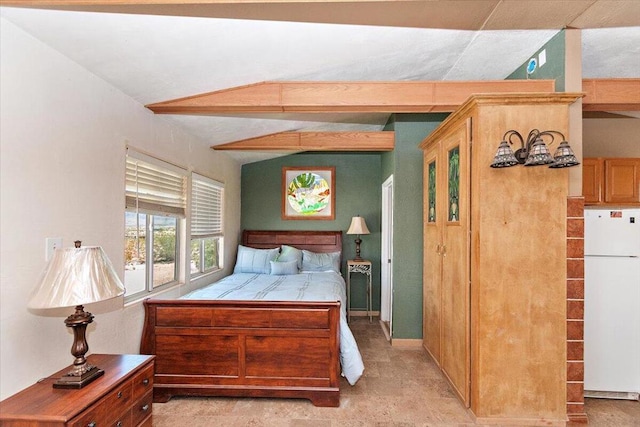 bedroom with vaulted ceiling and white refrigerator