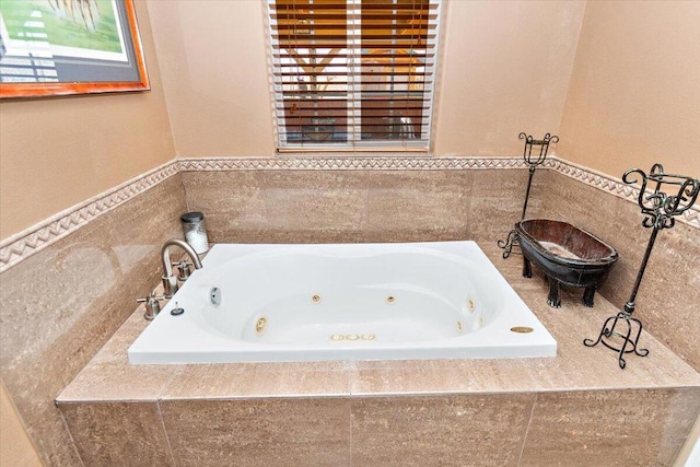 bathroom featuring a relaxing tiled tub