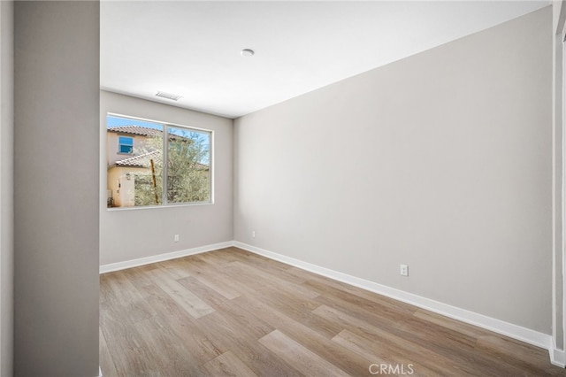 unfurnished room featuring light wood-type flooring