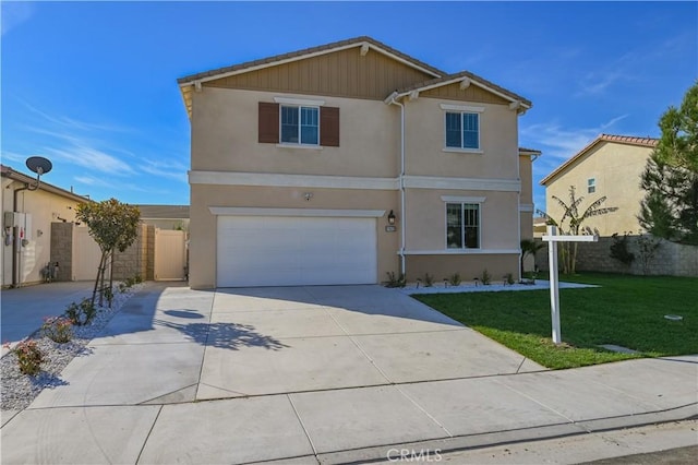 front of property featuring a garage and a front yard