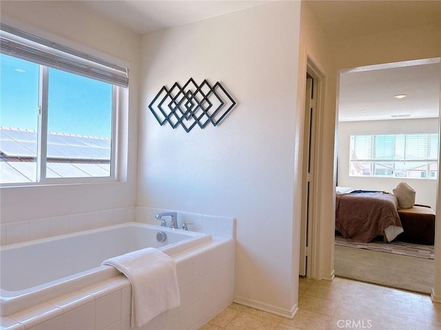 bathroom with tiled bath