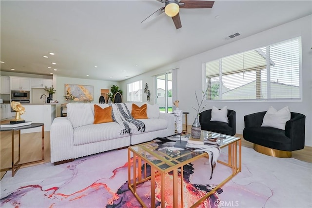 living room with ceiling fan