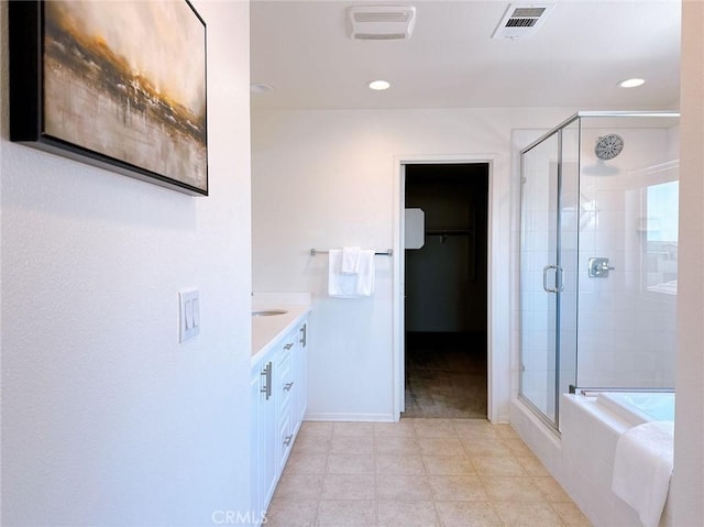 bathroom with plus walk in shower and vanity