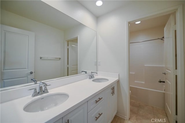 bathroom featuring vanity, tile patterned floors, and shower / bathing tub combination