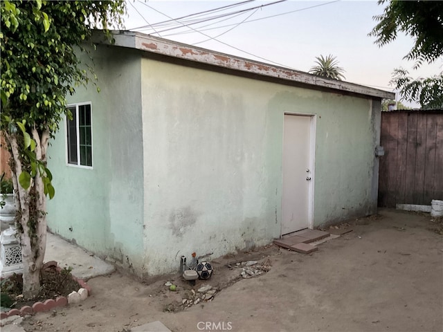 view of side of property featuring a patio area