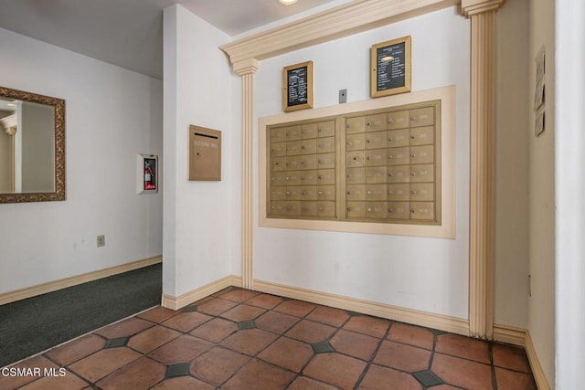 tiled spare room featuring mail boxes