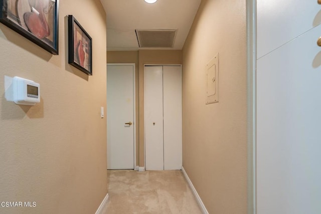 hallway with light carpet