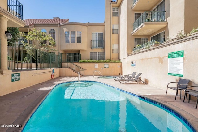 view of pool featuring a patio area