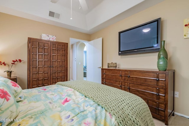 carpeted bedroom featuring a closet and ceiling fan