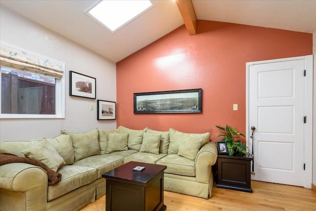 living room featuring wood-type flooring and lofted ceiling with beams