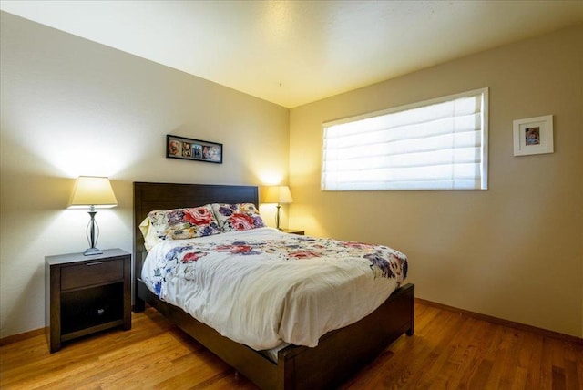 bedroom featuring hardwood / wood-style floors