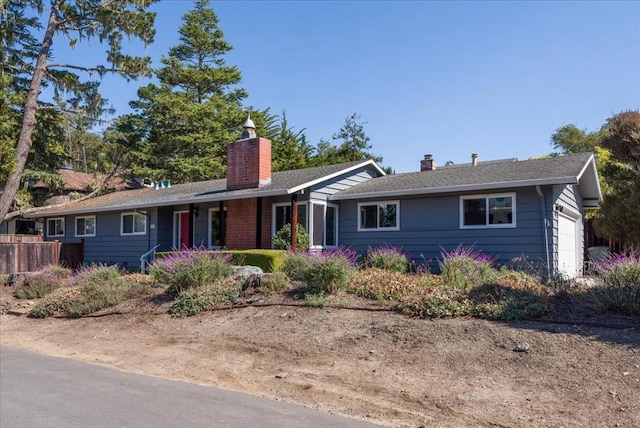 ranch-style house featuring a garage