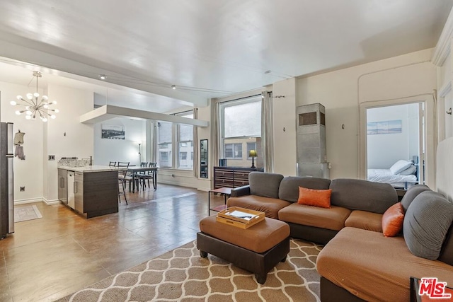 living room with an inviting chandelier