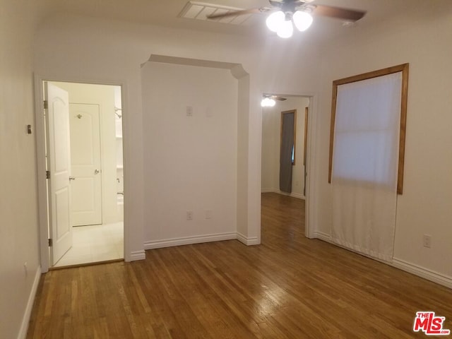 unfurnished room featuring hardwood / wood-style flooring and ceiling fan