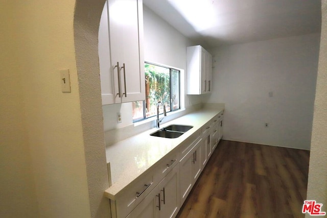 kitchen featuring sink, white cabinets, and dark hardwood / wood-style floors