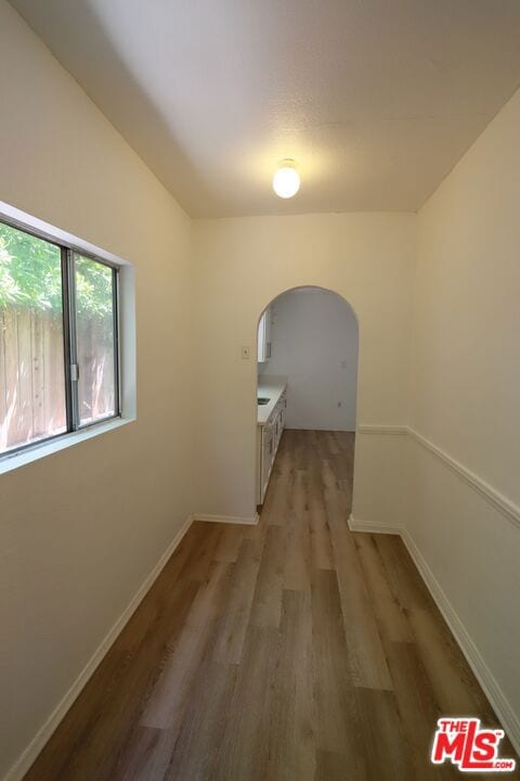 hall with light hardwood / wood-style floors