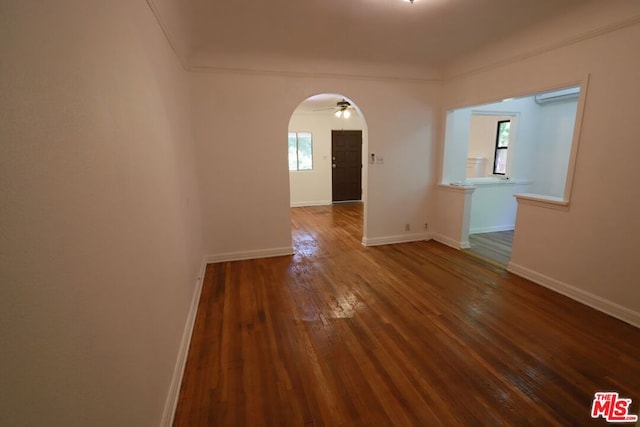 spare room with ceiling fan and dark hardwood / wood-style flooring