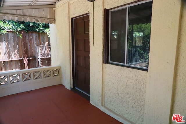 property entrance with a patio