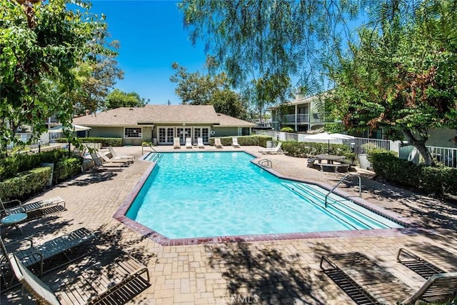 view of swimming pool featuring a patio area