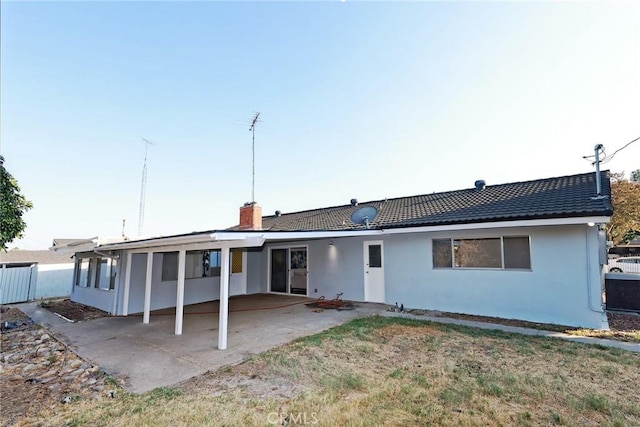 back of house with a patio area