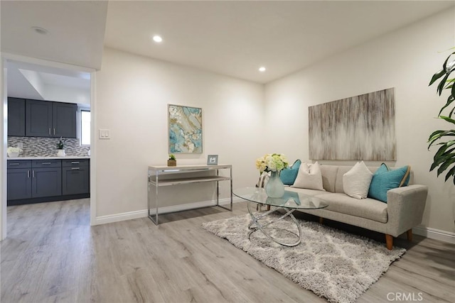 sitting room featuring light hardwood / wood-style floors