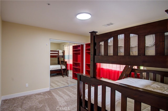 carpeted bedroom featuring a closet