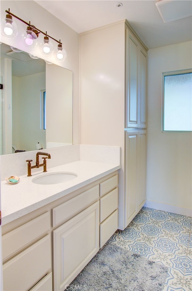 bathroom with vanity and tile patterned flooring