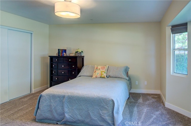 carpeted bedroom with a closet