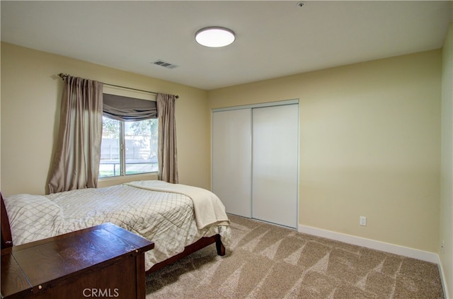 carpeted bedroom featuring a closet