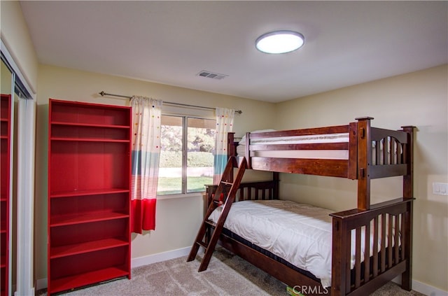 bedroom with a closet and carpet floors