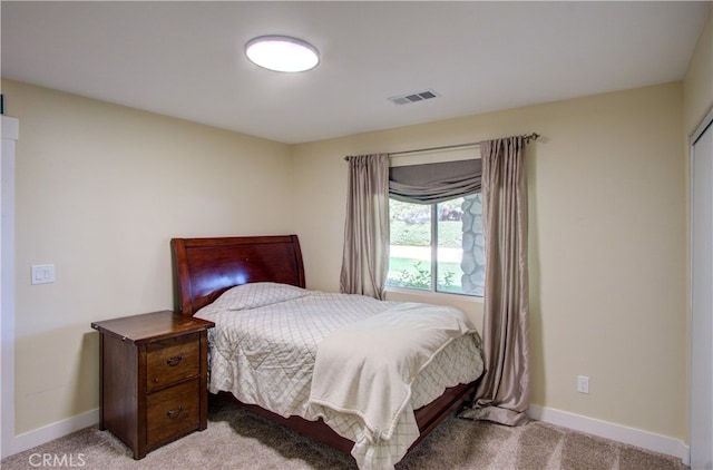 bedroom with light colored carpet