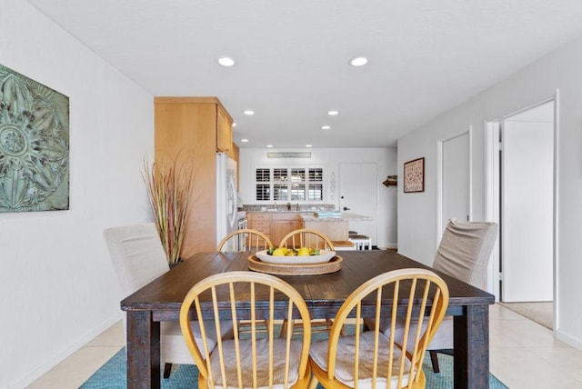 dining area with light tile patterned floors