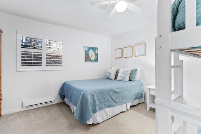 carpeted bedroom featuring ceiling fan and a baseboard radiator