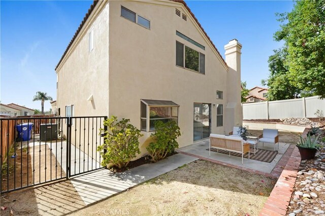 back of property with a patio area