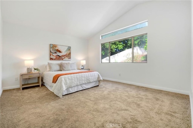 carpeted bedroom featuring vaulted ceiling