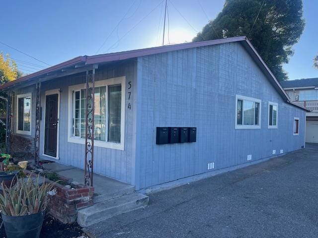 view of side of property with a garage