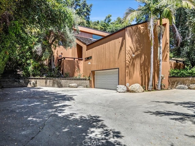 exterior space featuring driveway and an attached garage
