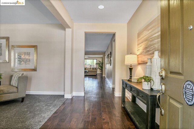 entryway with dark hardwood / wood-style flooring